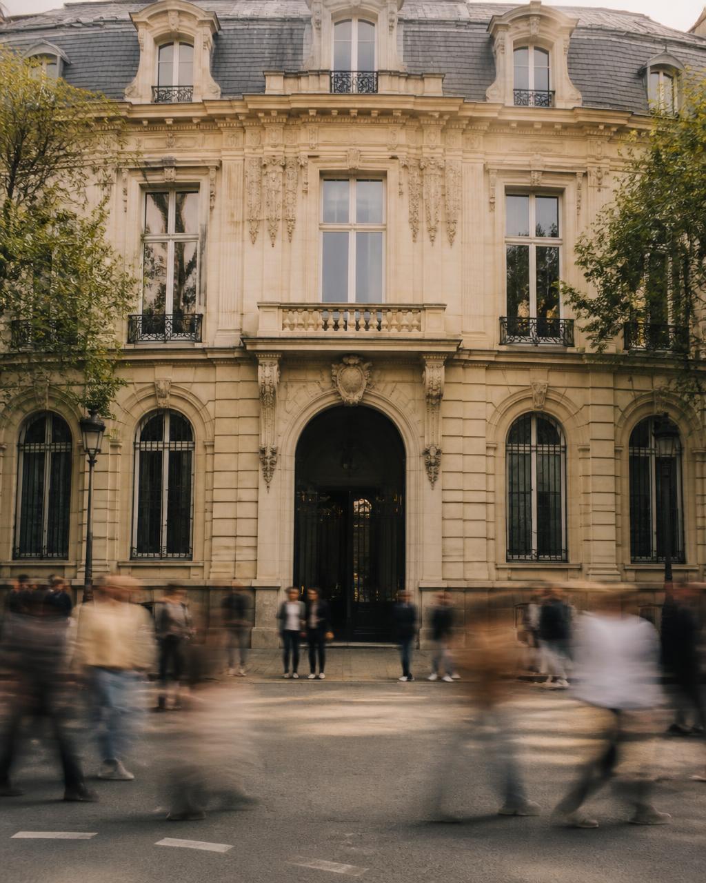 French authority building in Paris with passers-by in motion blur